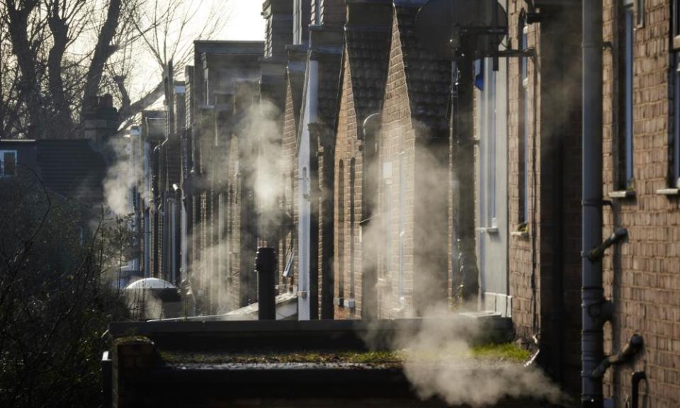 Residential dwellings exude steam in winter