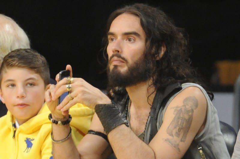 Russell Brand watches the Los Angeles Lakers play the Dallas Mavericks at an NBA basketball game in Los Angeles in 2012. File Photo by Lori Shepler/UPI