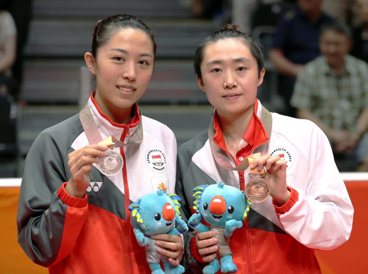 Table Tennis - Gold Coast 2018 Commonwealth Games - Women's Singles Medal Ceremony - Oxenford Studios - Gold Coast, Australia - April 14, 2018 - Silver medalist Mengyu Yu and bronze medalist Tianwei Feng of Singapore pose with medals. REUTERS/Jeremy Lee