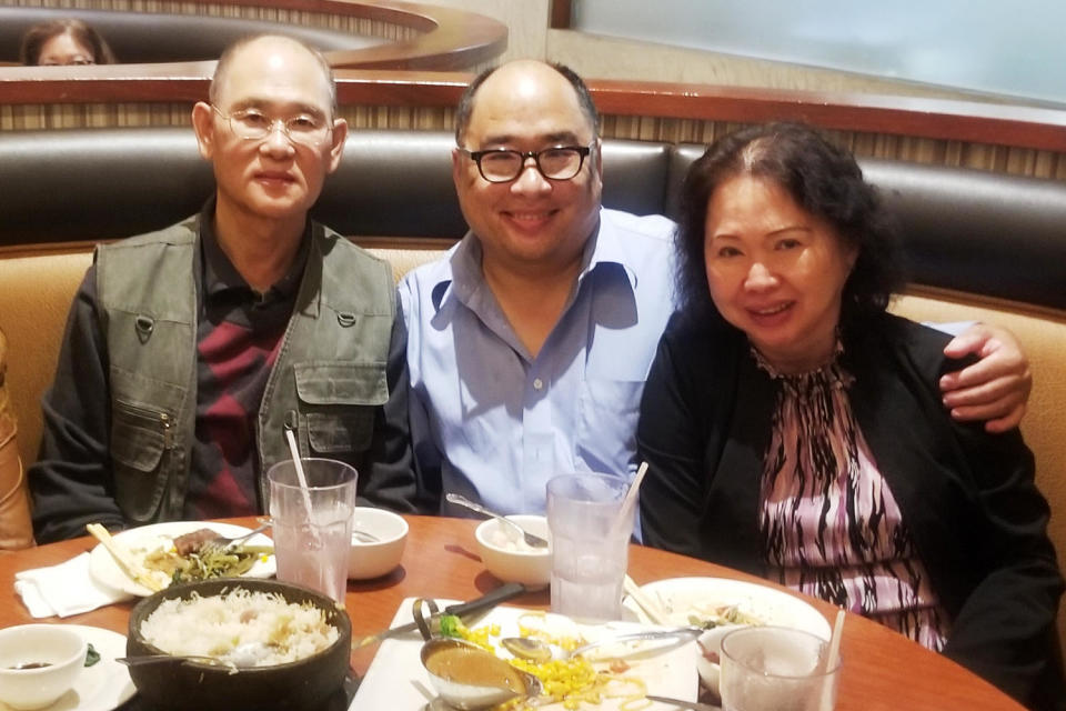 Andy Kao, Francois Ung, and Shally Ung. pose for a photo at a restaurant. (Courtesy Francois Ung)