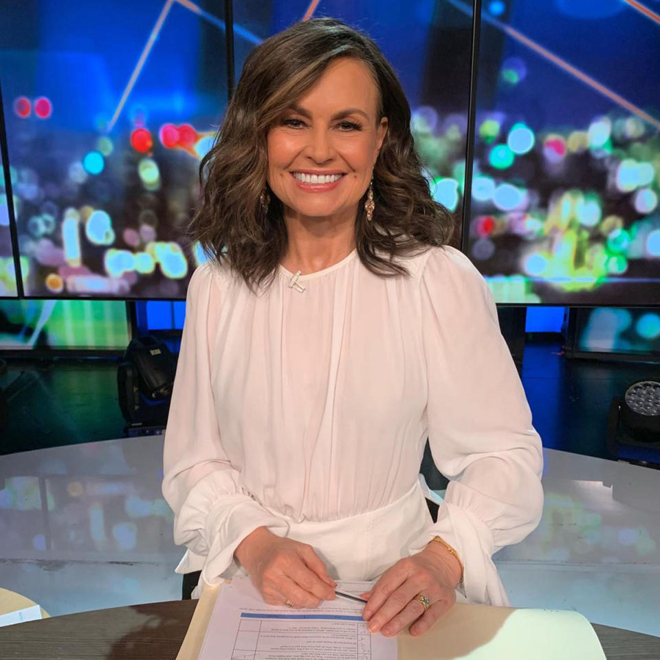 Lisa Wilkinson wears a white outfit on the set of The Project.