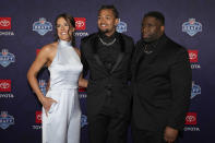 Washington wide receiver Rome Odunze, center, poses on the red carpet ahead of the first round of the NFL football draft, Thursday, April 25, 2024, in Detroit. (AP Photo/Carlos Osorio)