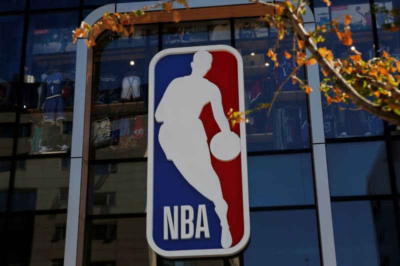 FILE PHOTO - An NBA logo is seen on the facade of its flagship store at the Wangfujing shopping street in Beijing