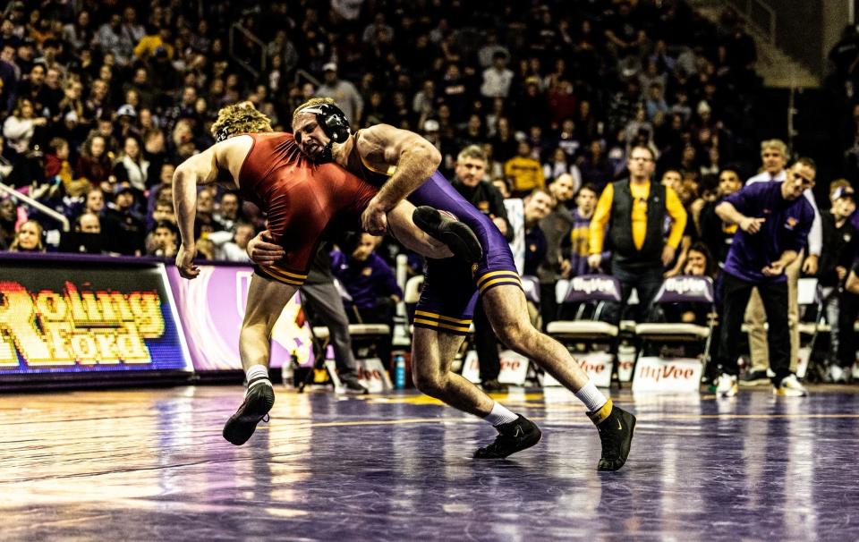 Northern Iowa's Cael Happel converts a takedown against Iowa State's Casey Swiderski at the McLeod Center in Cedar Falls.