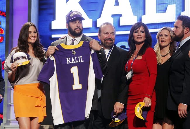 Southern California offensive lineman Matt Kalil poses for photographs with loved ones after being selected as the fourth pick overall by the Minnesota Vikings in the first round of the NFL football draft at Radio City Music Hall, Thursday, April 26, 2012, in New York. (AP Photo/Jason DeCrow)