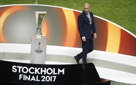 Football Soccer - Ajax Amsterdam v Manchester United - UEFA Europa League Final - Friends Arena, Solna, Stockholm, Sweden - 24/5/17 Ajax coach Peter Bosz looks at the trophy as he walks past after collecting his medal Reuters / Phil Noble Livepic