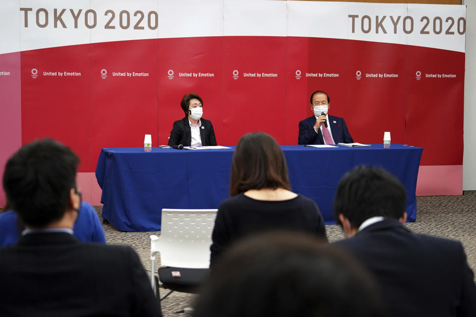 Seiko Hashimoto, left, president of the Tokyo 2020 Organizing Committee of the Olympic and Paralympic Games (Tokyo 2020), and Toshiro Muto, CEO of Tokyo 2020, attend a news conference Thursday, March 11, 2021, following the International Olympic Committee (IOC) general meeting. (AP Photo/Eugene Hoshiko, Pool)