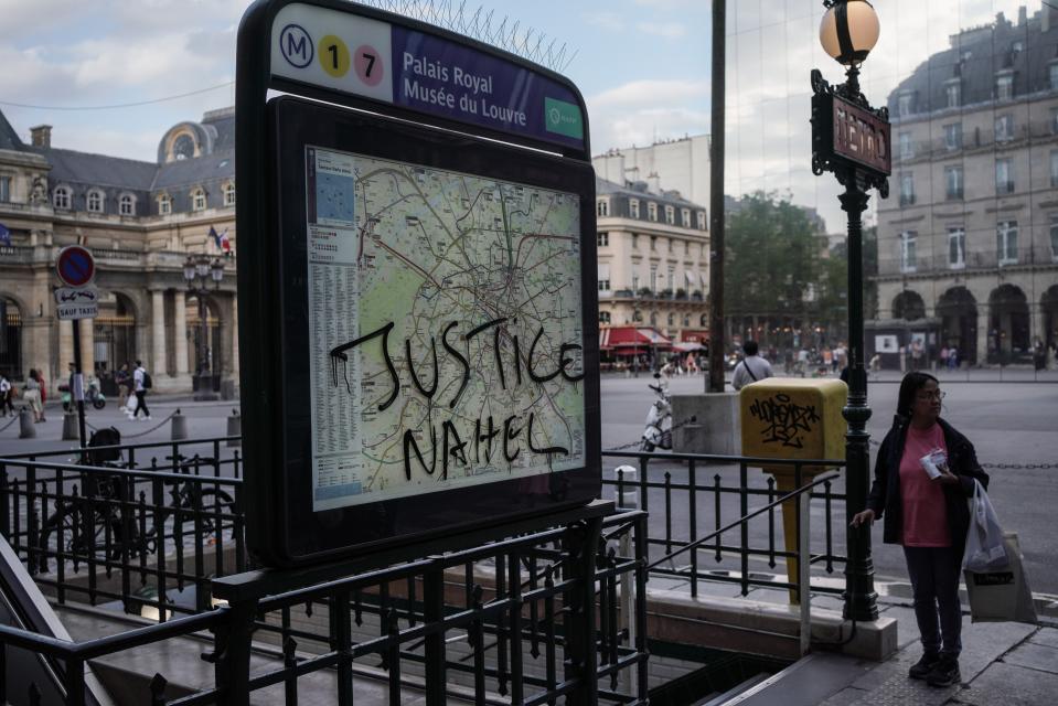 ‘Justice Nahel’ is scrawled the Palais Royal Musee du Louvre metro sign on 2 July 2023 in Paris, France (Getty Images)