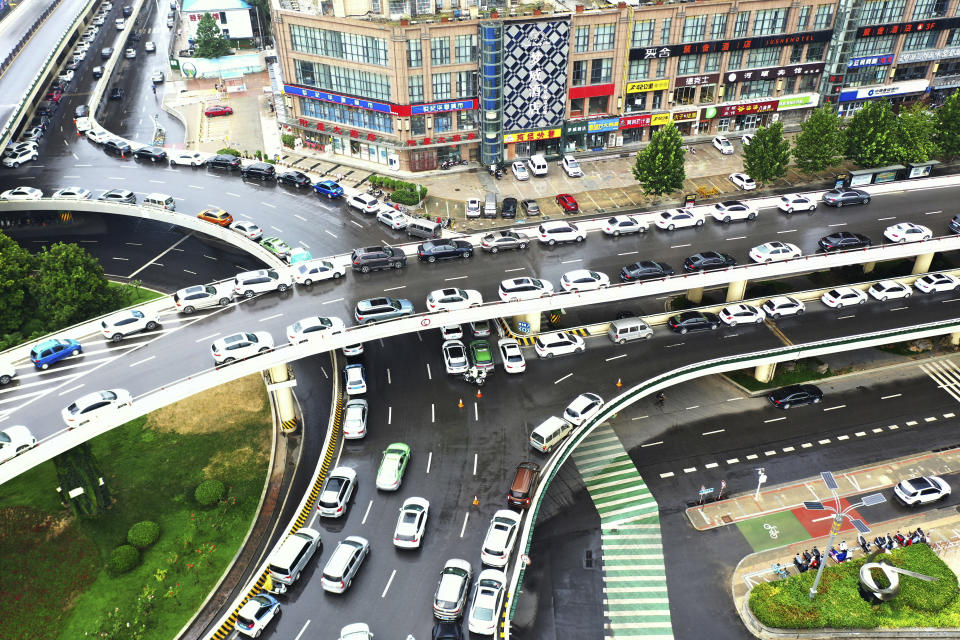 In this aerial photo released by Xinhua News Agency, cars are parked on elevated highways to avoid potential floods in Zhengzhou, in central China's Henan province on Sunday, Aug 22, 2021. Torrential rains in central China caused landslides, knocked out power and damaged houses, but no deaths were reported in a region where flooding killed more than 300 people last month, the government said Monday. (Hao Yuan/Xinhua via AP)