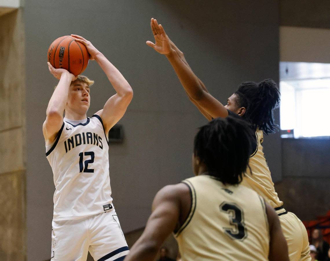 Keller shooting guard Rhett Schank (12) takes a jumper in double coverage during the first period of the Conference 6A Region 1 Regional Finals basketball playoffs at Wilkerson-Greines Activity Center in Fort Worth, Texas, Saturday, Mar. 02, 2024.