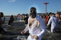 <p>Participants are seen in the water during a polar bear plunge at the beach in Coney Island, Brooklyn on Jan. 1, 2018. New Yorkers took part in new year’s day swim with temperature standing at -7 degrees Celsius. (Photo: Atilgan Ozdil/Anadolu Agency/Getty Images) </p>