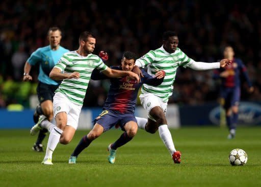 Barcelona's Pedro Rodriguez (C) trys to get between Celtic's Joe Ledley (L) and Victor Wanyama during their UEFA Champions League Group G match at Celtic Park in Glasgow. Celtic stunned Barca 2-1