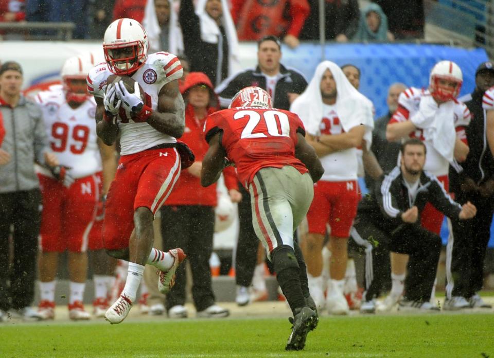 Nebraska wide receiver Quincy Enunwa (18) catches a pass for a 99-yard touchdown reception during the second half of the Gator Bowl NCAA college football game against Georgia, Wednesday, Jan. 1, 2014, in Jacksonville, Fla. Nebraska beat Georgia 24-19. (AP Photo/Stephen B. Morton)