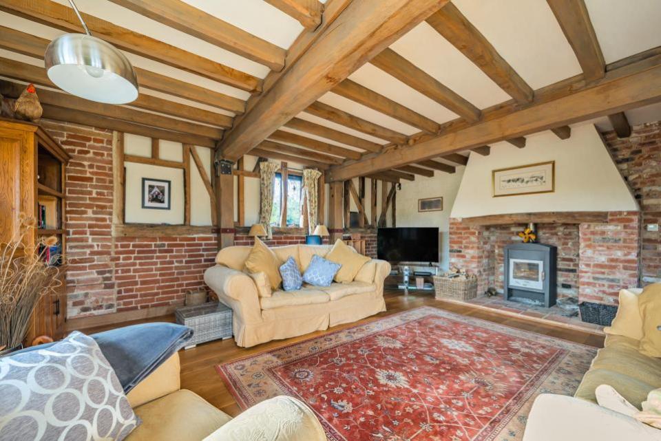 East Anglian Daily Times: The drawing room is a triple-aspect room, and features a wood burning stove