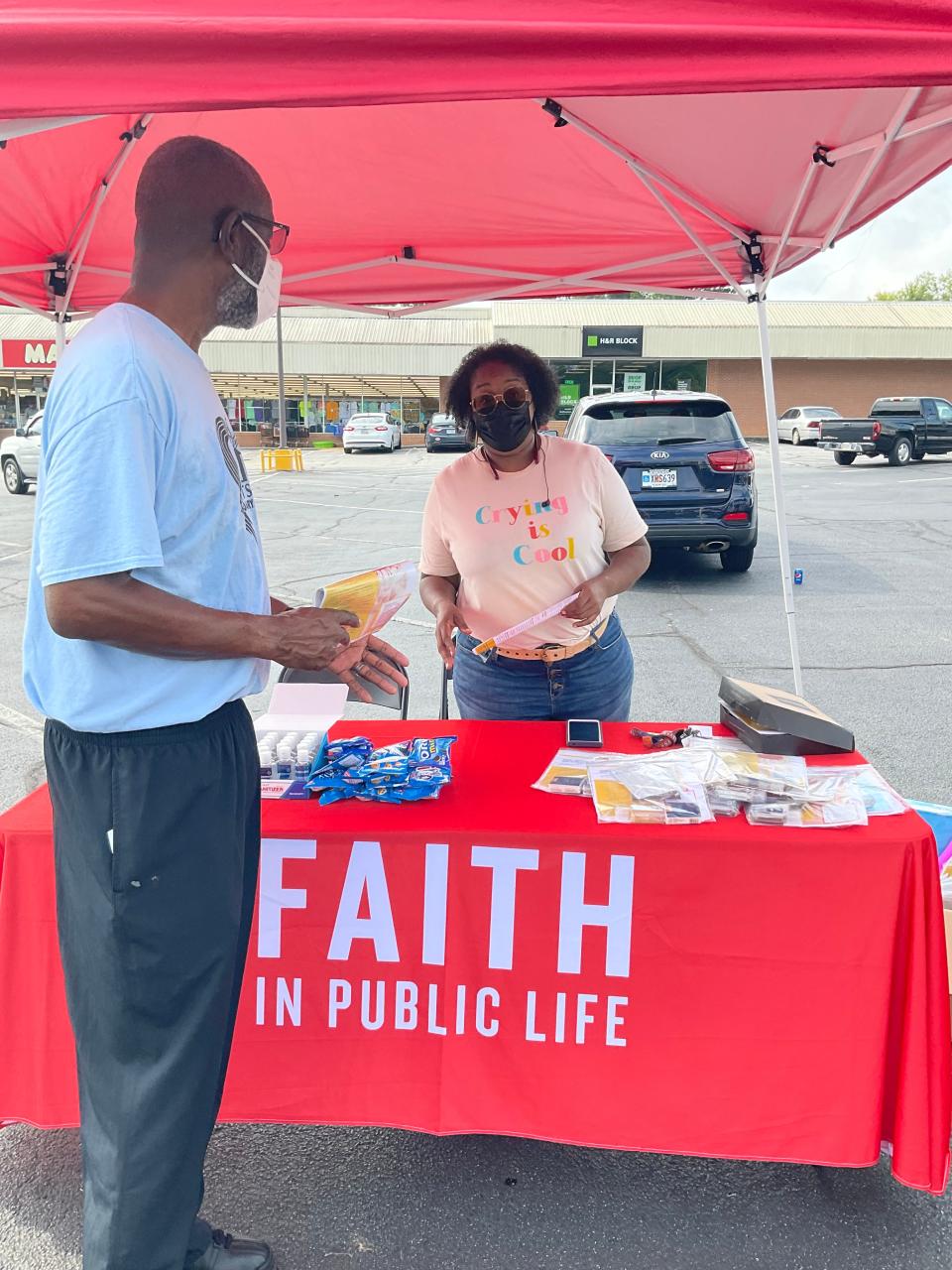 Shavonne Williams and other organizers with the "Keep the Faith, Get Vaccinated'' campaign set up a booth Aug. 7, 2021 in Wrens, Georgia where they partnered with local Black churches to distribute information and COVID-19.