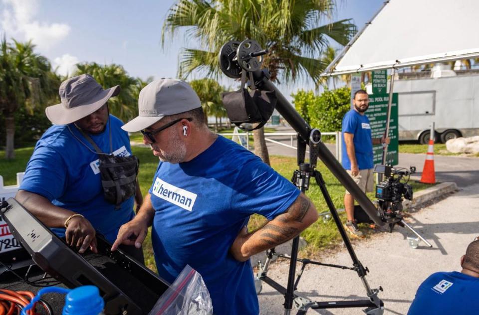 Alex Bailey (left), director of photography, and Antonio “Tony” Tur (right), drone pilot/operator, look back at the footage on the Atomos video monitor in Coral Gables, Fla., on July 11, 2023. Herman says they usually have a shot list and general plan of what they want to accomplish, but sometimes plans do not go accordingly on set. “But then you get out there and it’s sort of like a live performance that is modifying and adapting throughout the day,” he said. Lauren Witte/lwitte@miamiherald.com
