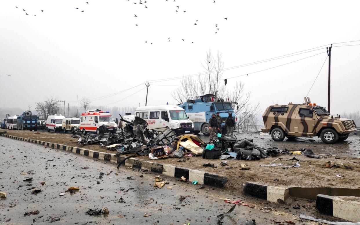 Indian soldiers examine the debris after an explosion in Lethpora in south Kashmir's Pulwama district - REUTERS