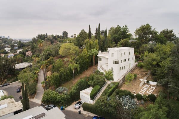 Mature trees wrap the historic home, presenting an idyllic oasis in the heart of Los Angeles.