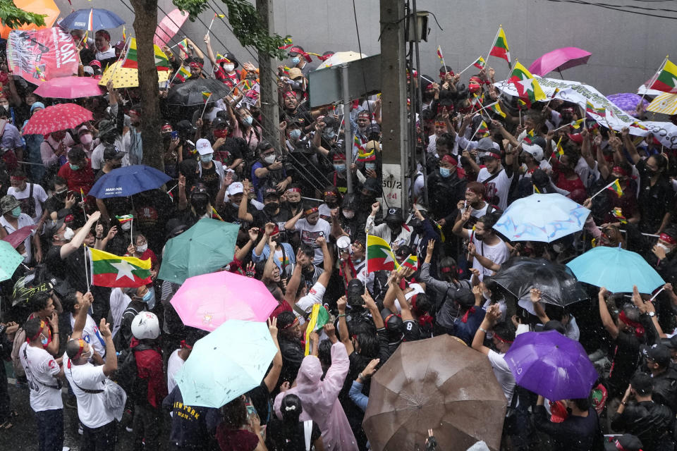 Myanmar nationals living in Thailand gather for a protest outside Myanmar's embassy in Bangkok, Thailand, Tuesday, July 26, 2022. International outrage over Myanmar’s execution of four political prisoners is intensifying with grassroots protests and strong condemnation from world governments. (AP Photo/Sakchai Lalit)