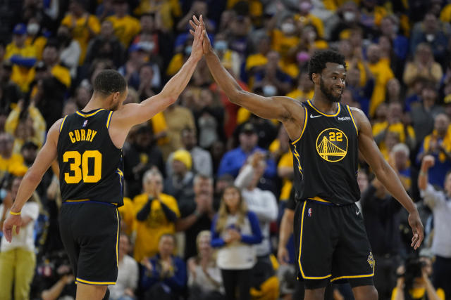 Golden State Warriors guard Stephen Curry (30) celebrates with forward Andrew Wiggins (22) during Game 5 of the NBA basketball playoffs Western Conference finals against the Dallas Mavericks in San Francisco, Thursday, May 26, 2022. (AP Photo/Jeff Chiu)