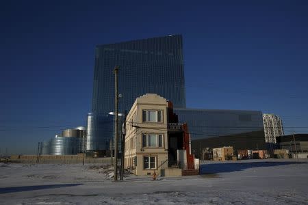 A house stands near the Revel Atlantic City, a casino and resort that opened in 2012 and closed in 2014, in Atlantic City, New Jersey January 21, 2016. REUTERS/Shannon Stapleton