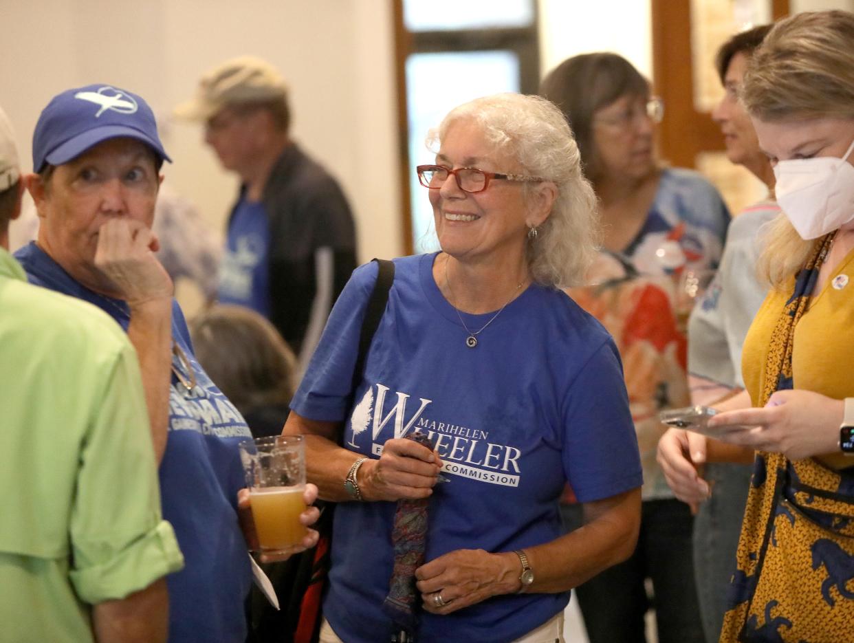 Marihelen Wheeler, who won her primary to defend her county commission seat, talks with supporters at an election night party at Cypress & Grove Brewery in Gainesville FL. August 23, 2022.