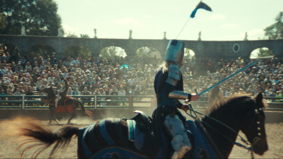 A night on a horse in the middle of a packed outdoor arena; still from 'Ren Faire'