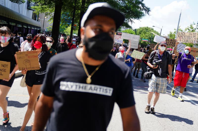 Protesters rally against racial inequality and the police shooting death of Rayshard Brooks, in Atlanta
