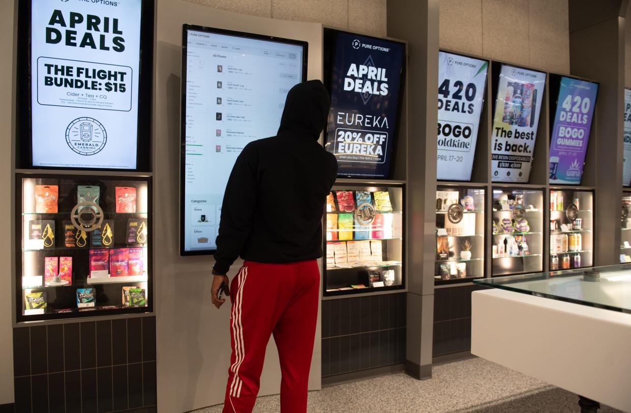 A patron shops at Pure Options Frandor location, Wednesday, April 17, 2024.