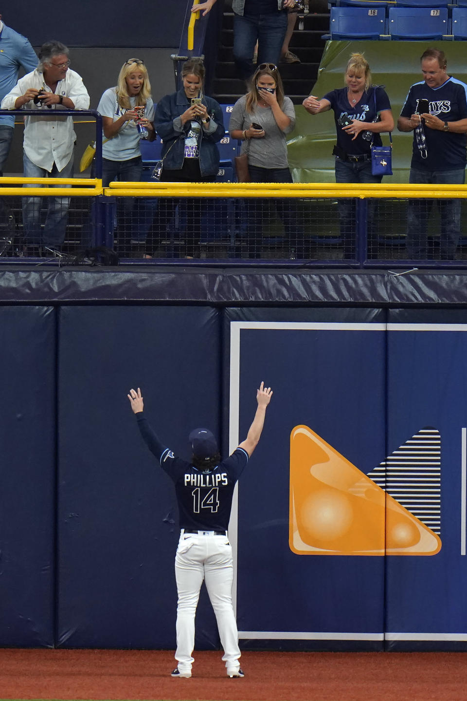 Tampa Bay Rays' Brett Phillips celebrates with family members after the Rays eliminated the Toronto Blue Jays during Game 2 of an American League wild-card baseball series Wednesday, Sept. 30, 2020, in St. Petersburg, Fla. (AP Photo/Chris O'Meara)