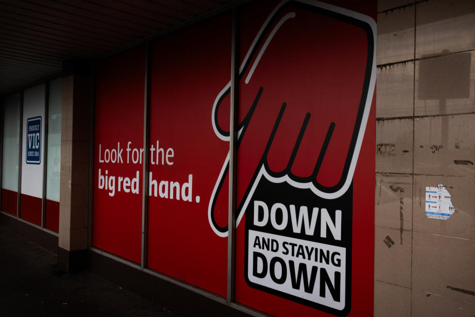 Coles supermarkets big red hand and down down advertising campaign signage displayed outside a coles supermarket on March 19, 2024 in Melbourne, Australia. Australia's two major supermarket chains, Coles and Woolworths, have come under scrutiny for their role in the cost of living crisis in the country, with both companies significantly increasing their profits during the pandemic while consumers faced rising living costs, local media reports said. Former cabinet minister Craig Emerson is leading a government inquiry into supermarket pricing practices, while former ACCC chair Allan Fels is conducting a separate investigation in collaboration with the Australian Council of Trade