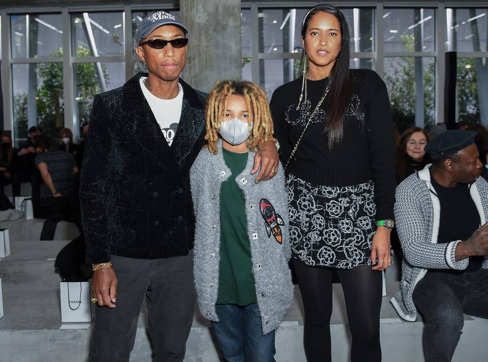 <p>Pharrell Williams, son Rocket and wife Helen attend the Chanel Métiers d'Art 2021/22 show at Le 19M on Dec. 7 in Paris.</p>