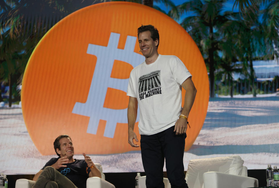 MIAMI, FLORIDA - JUNE 04:  Tyler Winklevoss and Cameron Winklevoss (L-R) creators of crypto exchange Gemini Trust Co. on stage at the Bitcoin 2021 Convention, a crypto-currency conference held at the Mana Convention Center in Wynwood on June 04, 2021 in Miami, Florida. The crypto conference is expected to draw 50,000 people and runs from Friday, June 4 through June 6th.  (Photo by Joe Raedle/Getty Images)