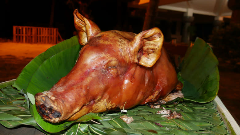 Pig head on banana leaves