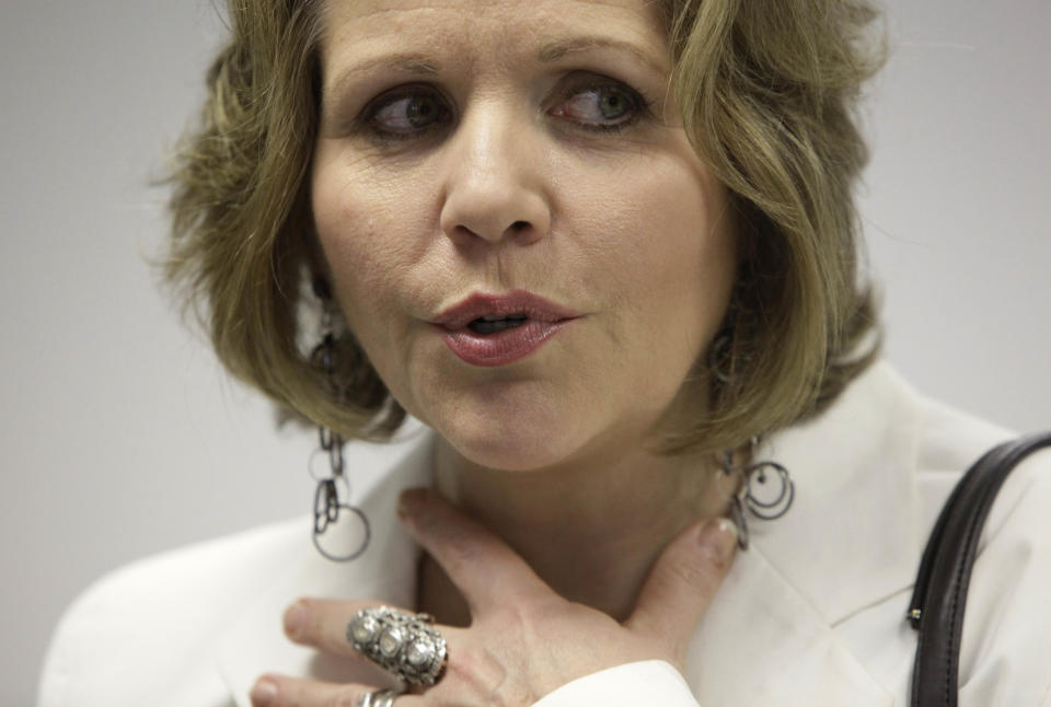 In this March 19, 2012 photo, famed soprano Renee Fleming talks to a reporter after performing with a choir of dozens of high school students in the rotunda of the State of Illinois building, the James R. Thompson Center, in Chicago. For the past school year the opera singer has been mentoring teenaged vocal students in Chicago as part of her role as creative consultant at the Lyric Opera of Chicago.(AP Photo/Kiichiro Sato)