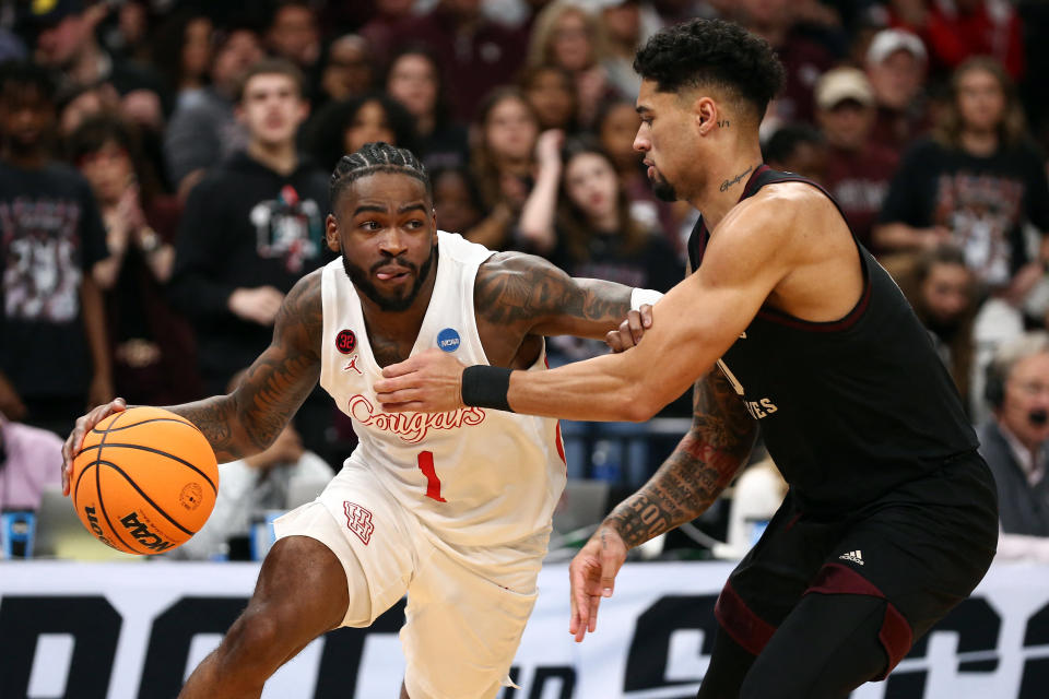 Jamal Shead and the Cougars pulled out a in in overtime after blowing a double-digit lead in the final minutes of regulation. (Petre Thomas/Reuters)