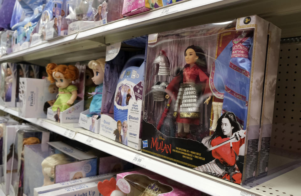 A doll based on the upcoming Walt Disney Studios film "Mulan" is displayed in the toy section of a Target department store, Thursday, April 30, 2020, in Glendale, Calif. Despite film delays, toy production and gaming companies are staying on schedule, releasing a variety of products tied to major titles in hopes of weathering through the pandemic. Most products are already in retail, appearing on store shelves and being sold online several months to a year ahead of the film’s new release date. (AP Photo/Chris Pizzello)