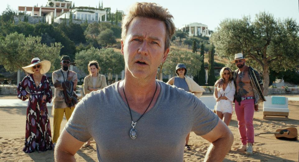 A tech billionaire (Edward Norton, center) brings a group of guests (Kate Hudson, Leslie Odom Jr., Kathryn Hahn, Jessica Henwick, Madelyn Cline and Dave Bautista) to his private Greek island in the sequel "Glass Onion: A Knives Out Mystery."