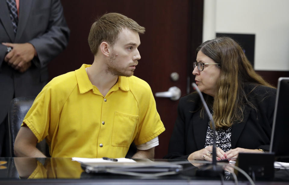 Travis Reinking, left, talks with attorney Joan Lawson during a hearing Wednesday, Aug. 22, 2018, in Nashville, Tenn. Reinking is charged with killing four people during a shooting at a Waffle House restaurant in Nashville in April. (AP Photo/Mark Humphrey)