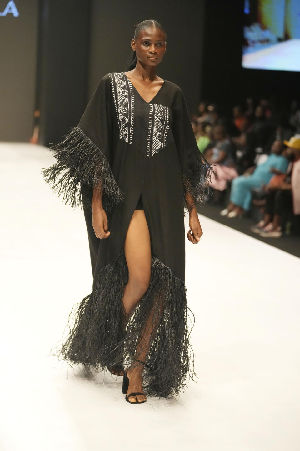 A model displays a creation by Cynthia Abila during the Lagos Fashion Week in Lagos, Nigeria, Thursday, Oct. 26, 2023. Africa's fashion industry is rapidly growing to meet local and international demands but a lack of adequate investment still limits its full potential, UNESCO said Thursday in its new report released at this year's Lagos Fashion Week show. (AP Photo/Sunday Alamba)