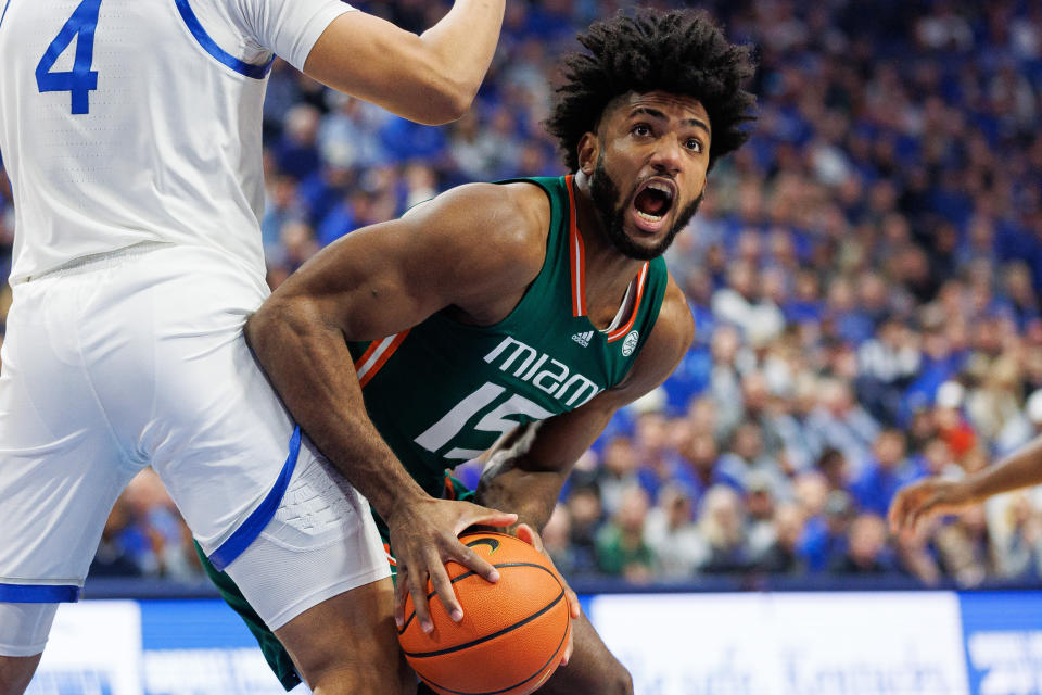 Nov 28, 2023; Lexington, Kentucky, USA; Miami (Fl) Hurricanes forward <a class="link " href="https://sports.yahoo.com/ncaab/players/158665" data-i13n="sec:content-canvas;subsec:anchor_text;elm:context_link" data-ylk="slk:Norchad Omier;sec:content-canvas;subsec:anchor_text;elm:context_link;itc:0">Norchad Omier</a> (15) drives to the basket during the first half against the Kentucky Wildcats at Rupp Arena at Central Bank Center. Mandatory Credit: Jordan Prather-USA TODAY Sports