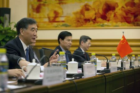 Chinese Vice Premier Wang Yang, at left, speaks at a meeting with U.S. Treasury Secretary Jack Lew at the Zhongnanhai Leadership Compound in Beijing March 30, 2015. REUTERS/Mark Schiefelbein/Pool