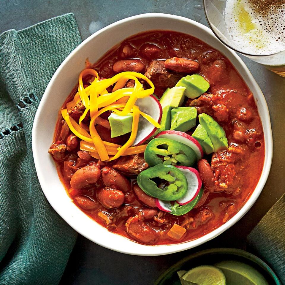 <p>This classic red chili has chunks of stew meat and ground beef along with tomatoes, red beans, and spices. Fire-roasted tomatoes add a note of smokiness to the mix. If you can't find fire-roasted, use plain tomatoes and add a pinch of smoked paprika.</p> <p><a href="https://www.myrecipes.com/recipe/beef-bean-chili" rel="nofollow noopener" target="_blank" data-ylk="slk:Beef-and-Bean Chili Recipe;elm:context_link;itc:0;sec:content-canvas" class="link ">Beef-and-Bean Chili Recipe</a></p>