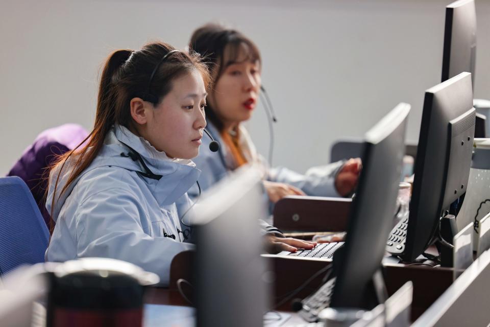 Employees work at dispatching and monitoring center of Qingdao Teld New Energy Co., Ltd. on March 5, 2024 in Qingdao, Shandong Province of China. - Copyright: Han Jiajun/VCG via Getty Images