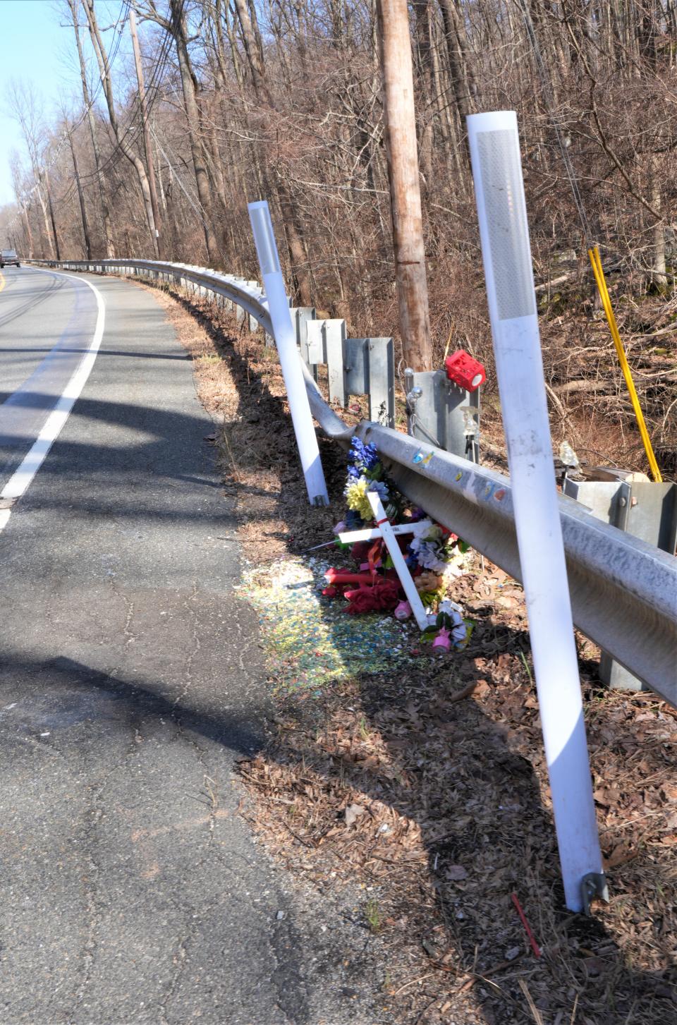 A roadside memorial along Newton Sparta Road, marks the site of a May 26, 2023 crash which killed three members of the Benavente family and the lone occupant of another vehicle.