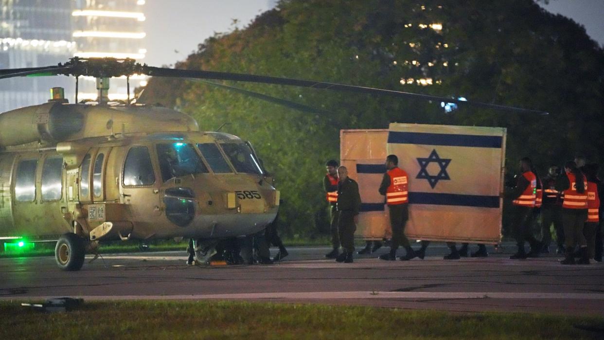  A helicopter arrives with freed Israeli hostages. 