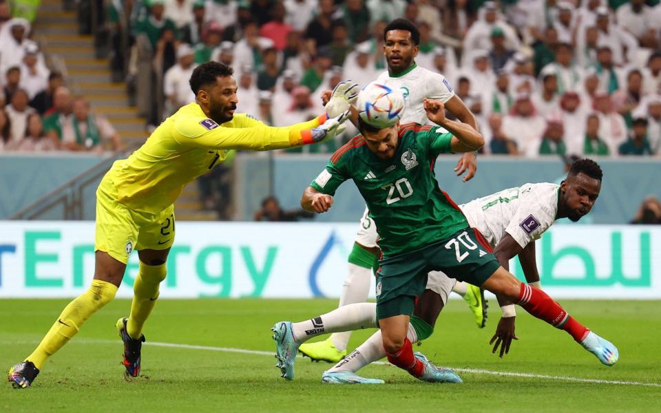 Saudi Arabia's Mohammed Al-Owais in action with Mexico's Henry Martin - Kai Pfaffenbach/Reuters