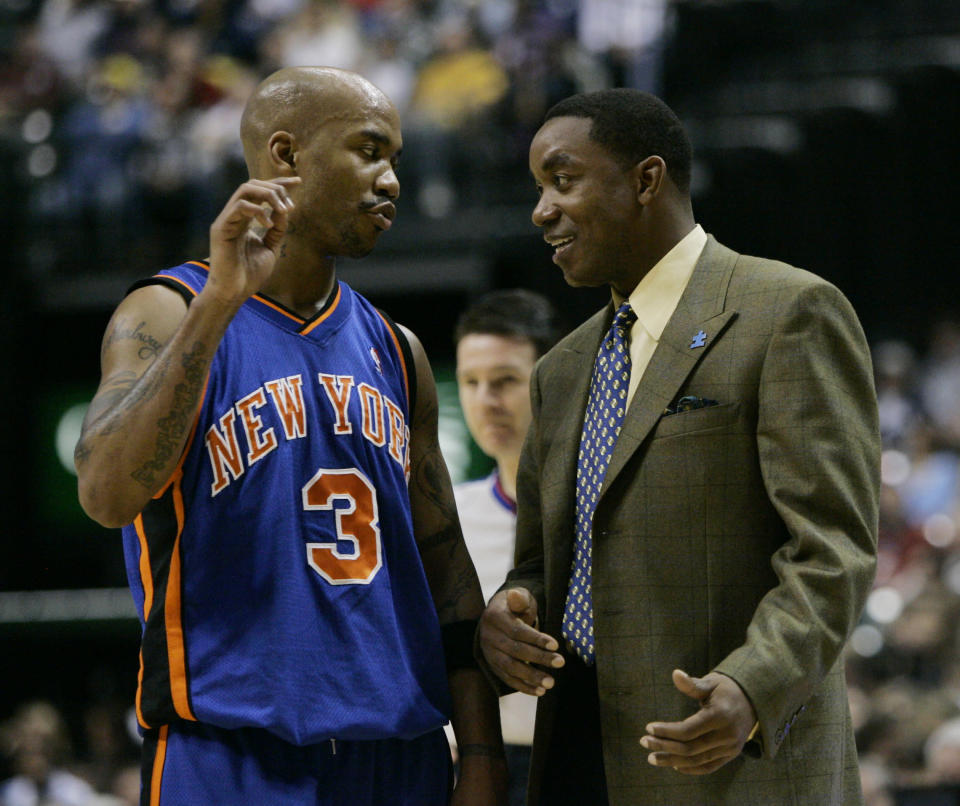 New York Knicks guard Stephon Marbury , left, talks with New York Knicks coach Isiah Thomas during the second quarter of an NBA basketball game against the Indiana Pacers in Indianapolis, Friday,Dec. 15, 2006. (AP Photo/Darron Cummings)