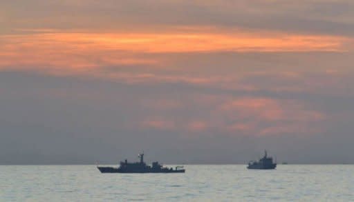 A Philippine navy photo shows Chinese surveillance ships off Scarborough Shoal, on April 11. The Philippines alleged Saturday that China had again increased its presence around a disputed shoal and had harassed a Filipino civilian vessel, after the week-old standoff appeared to have eased
