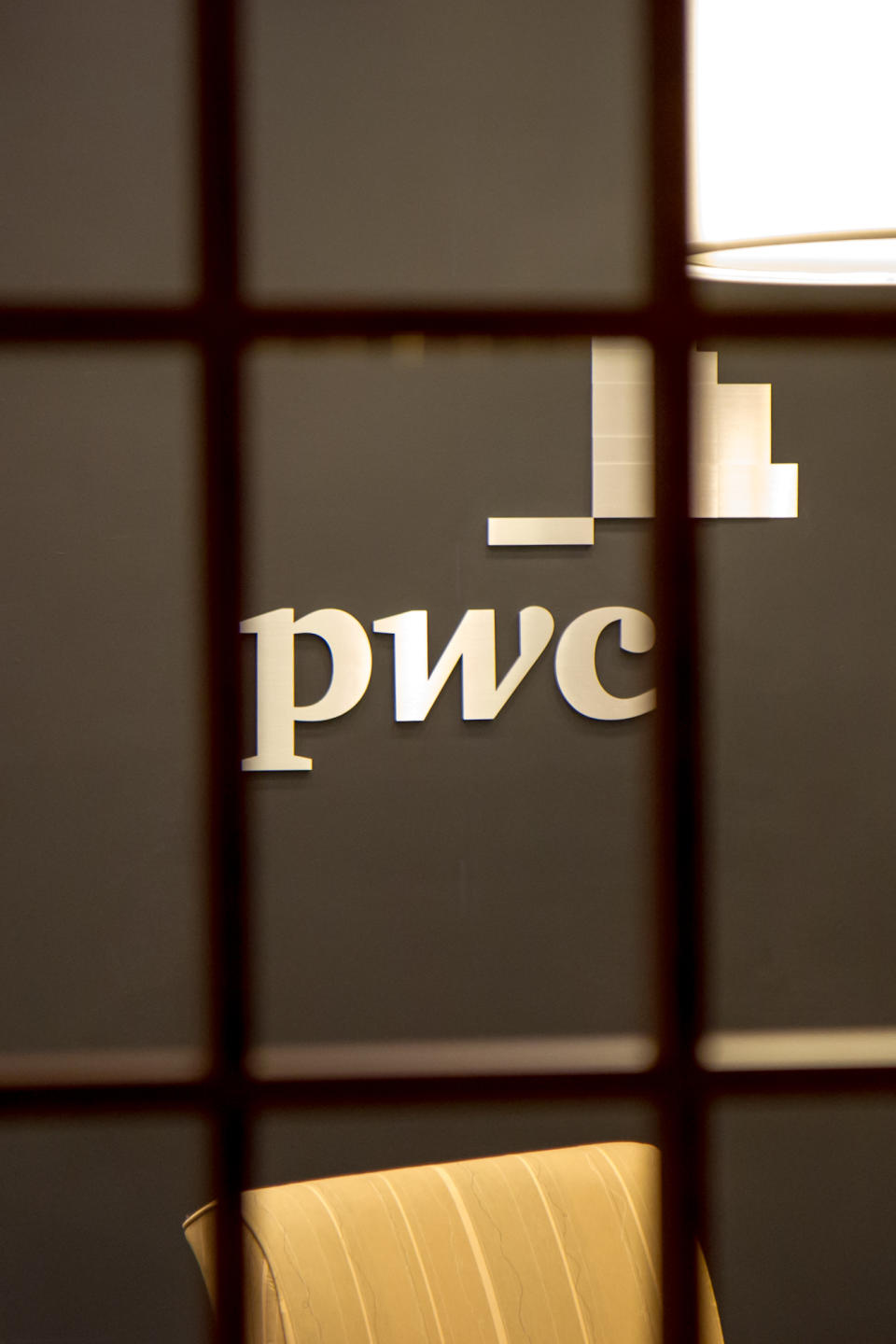 The PricewaterhouseCoopers office in Franklin, Tenn., is seen from outside its doors on Wednesday, Sept. 5, 2012. The Secret Service said is investigating the reported theft of copies houses Republican presidential candidate Mitt Romney's federal tax records during a break-in at the office. The company said there was no evidence that any Romney tax files were stolen. (AP Photo/Erik Schelzig)